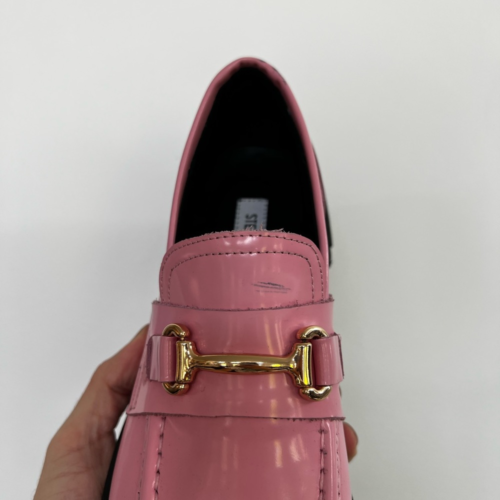 A pair of pink lado Steven Madden shoes.